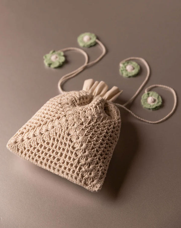 Handmade crochet pouch, stylish eco-friendly accessory by The Mango House Trust