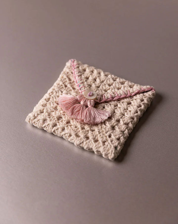 Handmade crochet pouch, eco-friendly and stylish accessory by The Mango House Trust