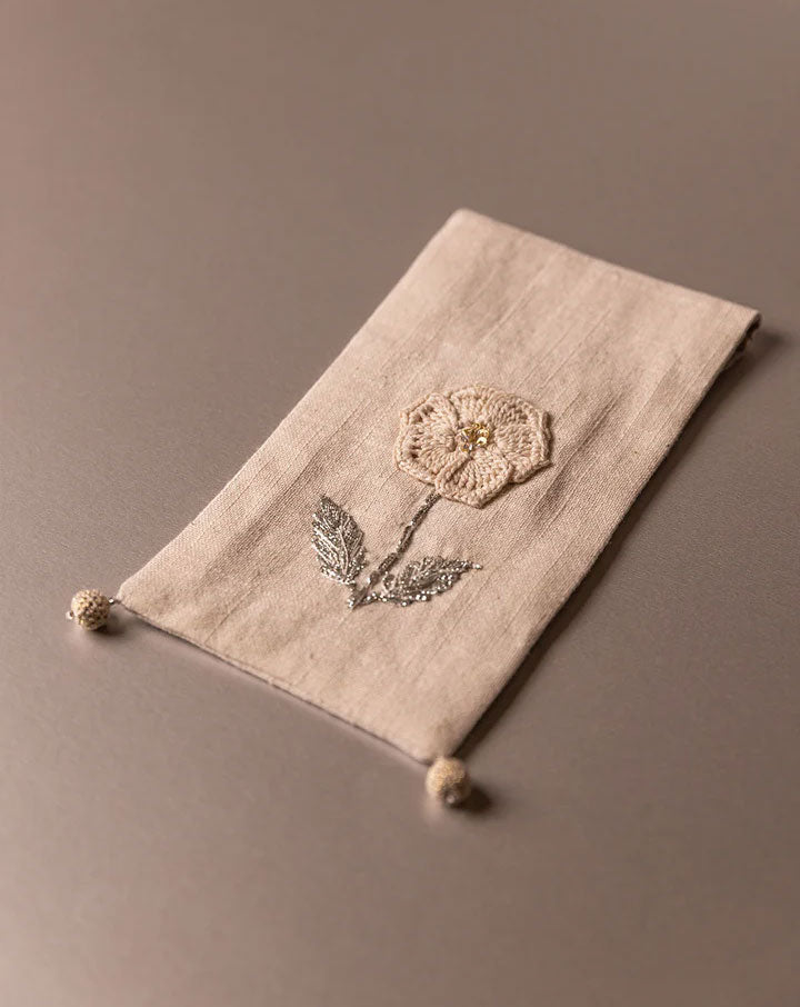 Elegant handcrafted crochet pouch, eco-friendly design by The Mango House Trust