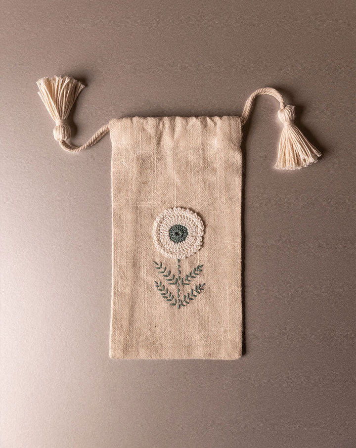 Chic handmade crochet pouch, sustainable everyday accessory by The Mango House Trust